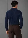 camisa_azul_posterior_web.webp